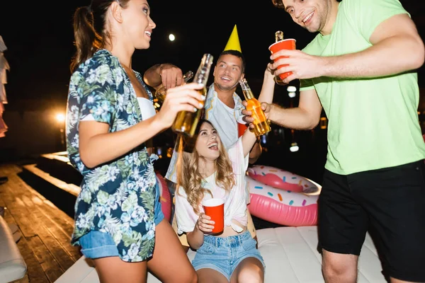Selective Focus Friends Holding Beer Bottles Disposable Cups Party Deck — Stock Photo, Image