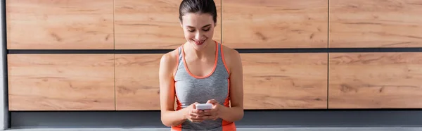 Panoramic Shot Sportswoman Using Smartphone Home — Stock Photo, Image