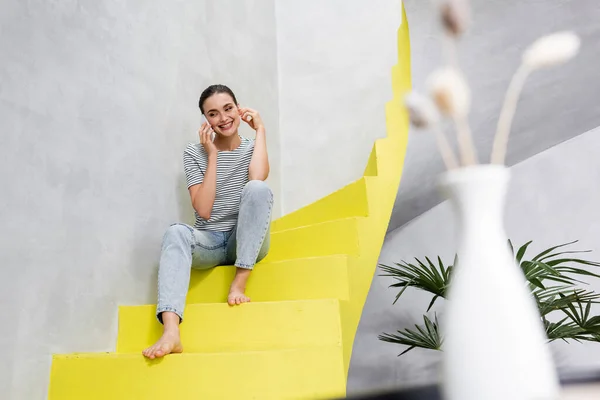 Selective Focus Young Woman Talking Smartphone While Sitting Stairs Home — Stock Photo, Image