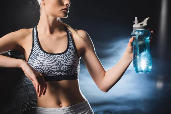 Cropped View Sportswoman Holding Sports Bottle Tire Gym Smoke — Stock Photo, Image