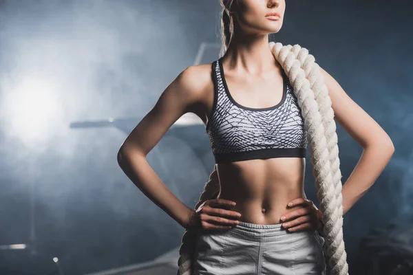 Cropped View Young Sportswoman Battle Rope Hands Hips Standing Gym — Stock Photo, Image