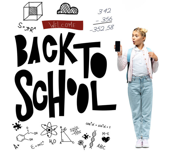 Excited schoolkid looking at smartphone near welcome back wo school lettering on white background