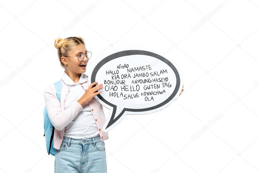 Schoolchild with backpack holding speech bubble with greeting lettering isolated on white 