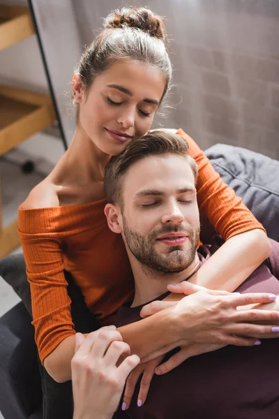 Happy Woman Embracing Boyfriend While Resting Sofa Closed Eyes — Stock Photo, Image