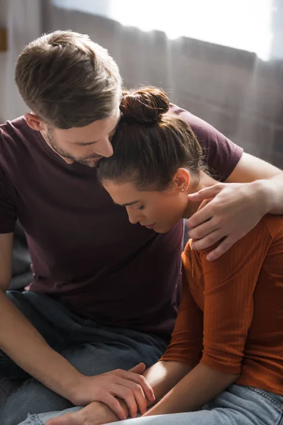 Responsive Man Hugging Calming Offended Woman Sitting Bowed Head — Stock Photo, Image