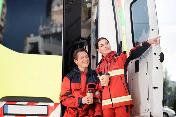 Paramedic Pointing Finger Colleague Coffee Ambulance Car — Stock Photo, Image