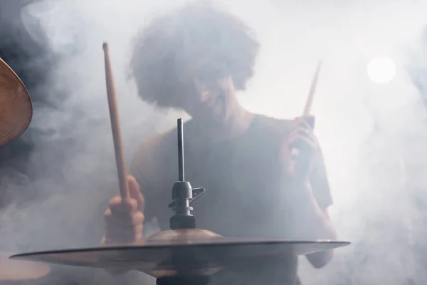 Smiling Curly Drummer Drumsticks Playing Drums Smoke — Stock Photo, Image
