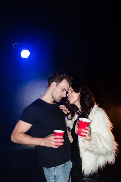 Smiling Woman Closed Eyes Touching Boyfriend Shirt While Holding Plastic — Stock Photo, Image