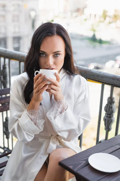 Brunette Woman White Robe Drinking Tea Sitting Balcony — Stock Photo, Image