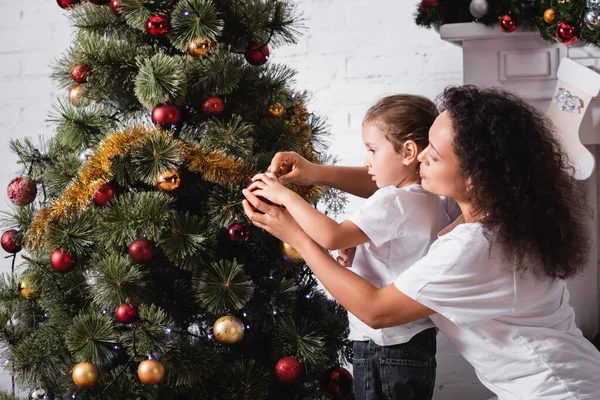 Side View Mom Daughter Decorating Christmas Pine Fireplace Home — Stock Photo, Image