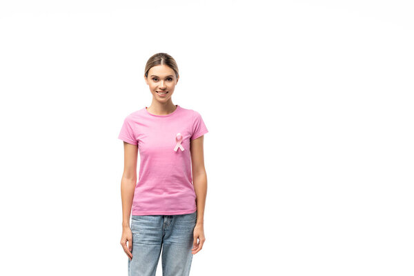 Young woman in pink t-shirt with breast cancer awareness ribbon looking at camera isolated on white