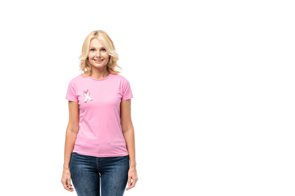 Blonde woman in t-shirt with pink ribbon of breast cancer awareness isolated on white