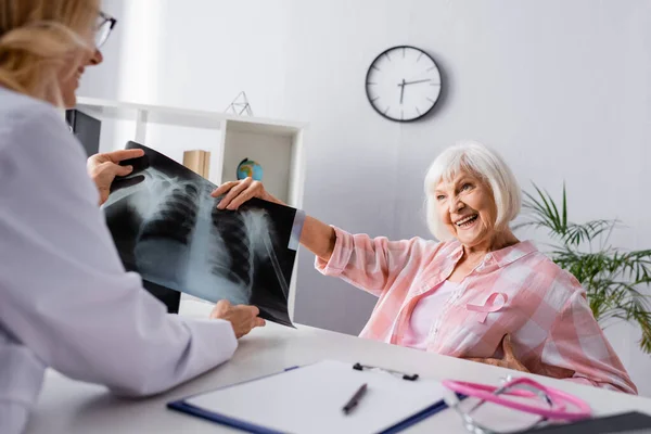 Selective Focus Elderly Woman Holding Chest Ray Doctor Workplace — Stock Photo, Image