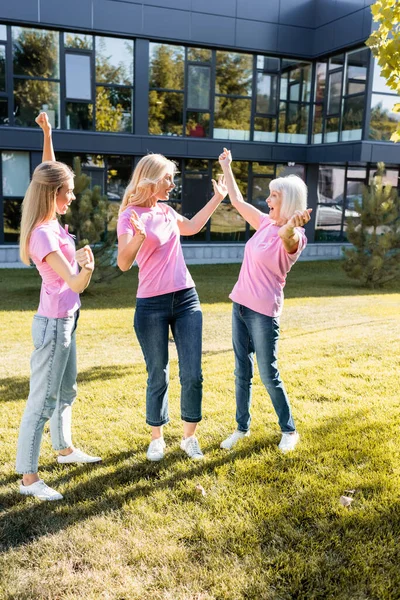 Excited Three Women Pink Shirts Ribbons Breast Cancer Awareness — Stock Photo, Image