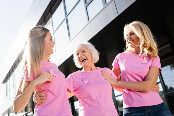 Three Women Hugging Laughing Signs Breast Cancer Awareness Outdoors — Stock Photo, Image