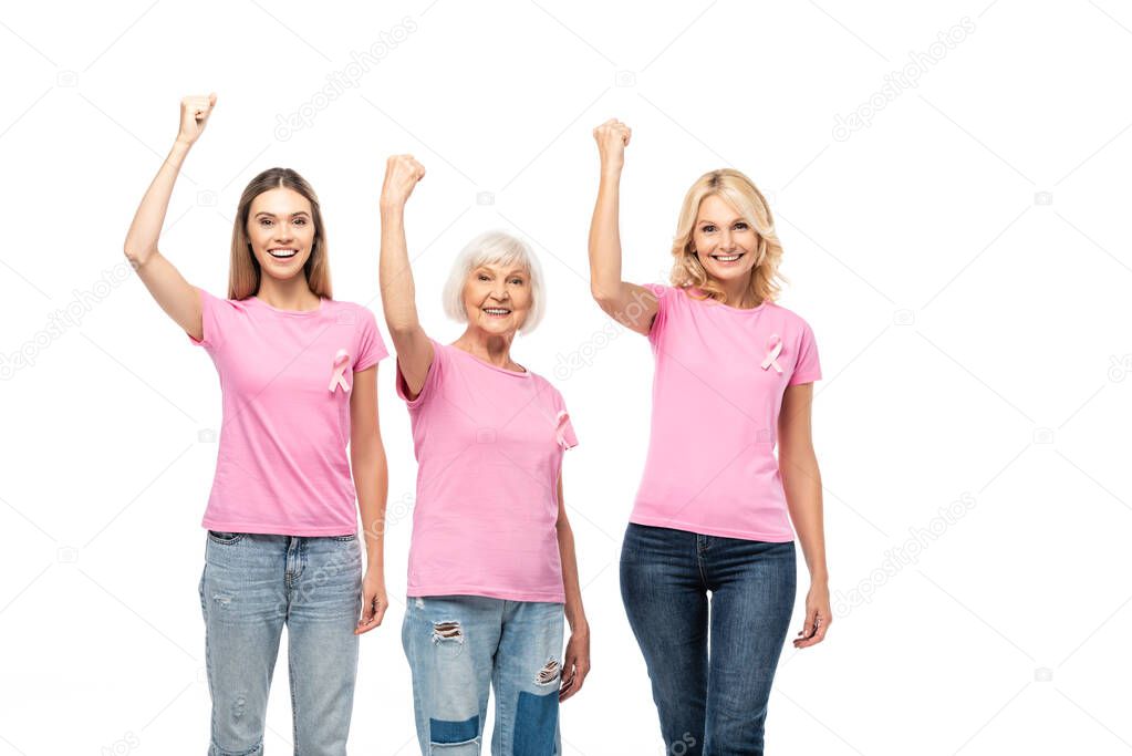 Women looking at camera and showing yeah gesture isolated on white, concept of breast cancer awareness 