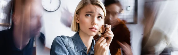 Sad Businesswoman Holding Eyeglasses Looking While Sitting Open Space Office — Stock Photo, Image