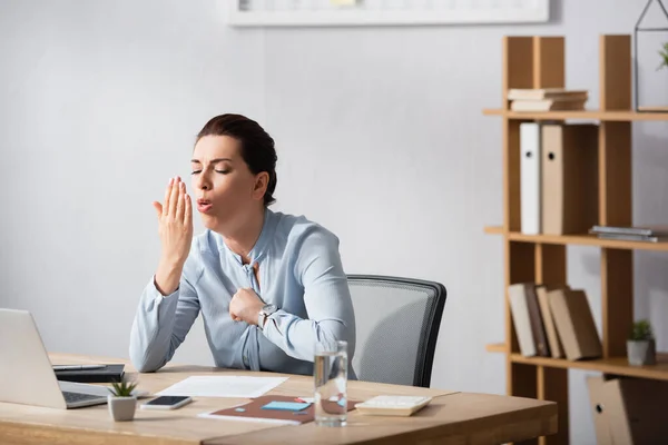 Brunette Businesswoman Fist Chest Coughing Palm While Sitting Workplace Office — Stock Photo, Image
