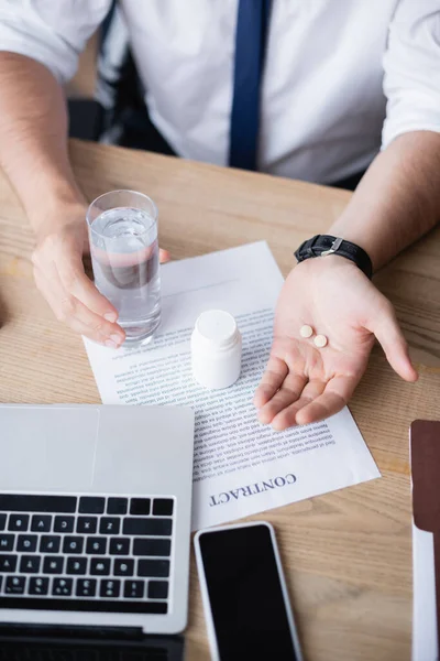 Cropped View Businessman Holding Glass Water Pills While Sitting Workplace — Stock Photo, Image