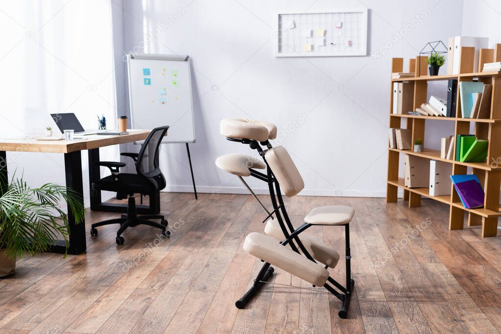 Interior of spacious office with modern design and massage chair