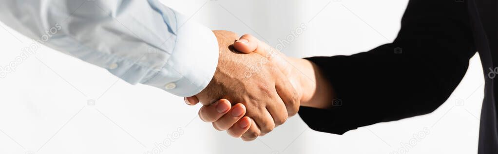 cropped view of politicians shaking hands on white, banner