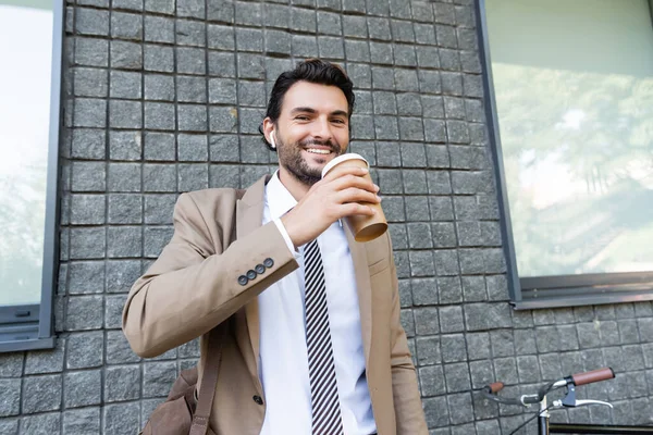 Happy Businessman Wireless Earphones Holding Paper Cup Building — Stock Photo, Image