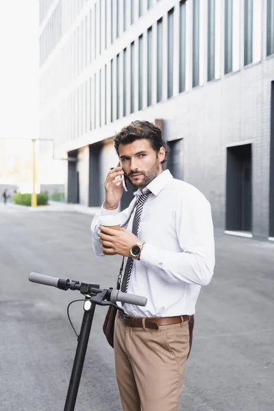 Bearded Businessman Formal Wear Holding Paper Cup Talking Smartphone Scooter — Stock Photo, Image