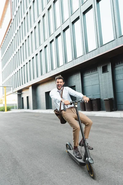 Full Length Excited Businessman Formal Wear Riding Electric Scooter Building — Stock Photo, Image