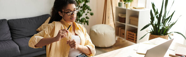 Bright modern apartment features a young woman focused on her freelance tasks, banner