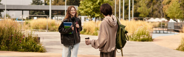 A loving couple shares laughter while strolling through a beautiful park on a mild day.