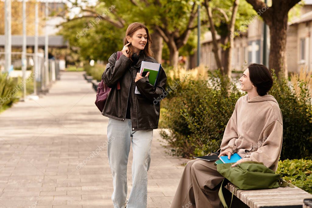 A young couple enjoys joyful moments walking and chatting under sunny tree lined paths.