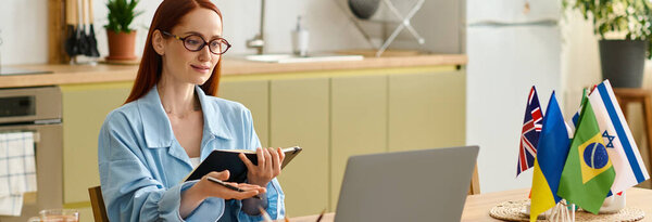 Woman with red hair teaches language classes online from her stylish home workspace, using a laptop, banner