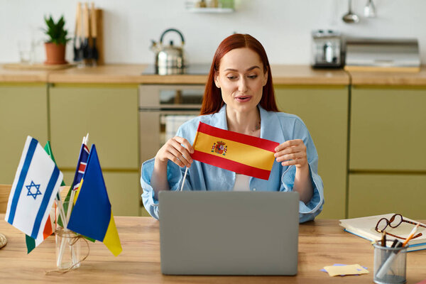 Red-haired teacher shares her enthusiasm for languages while teaching online from home.