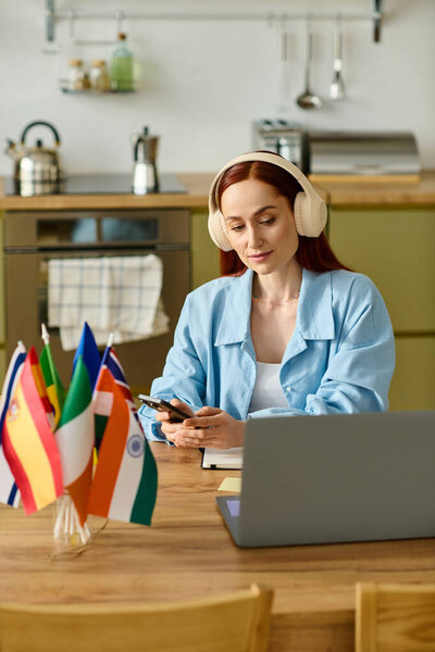 Remote language teacher engages with her students through laptop while working from home.