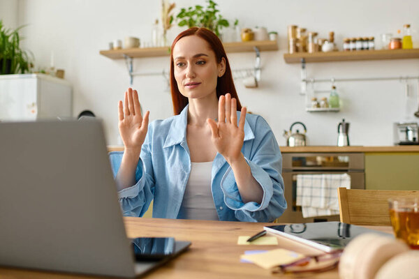 A woman with red hair teaches languages online from her cozy home office, connecting with students.