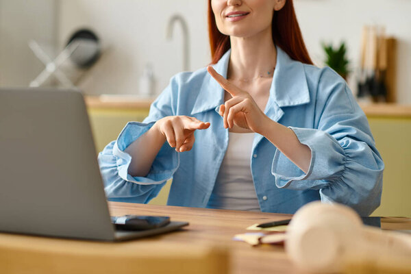 A red-haired woman teaches an online language class from her cozy home.
