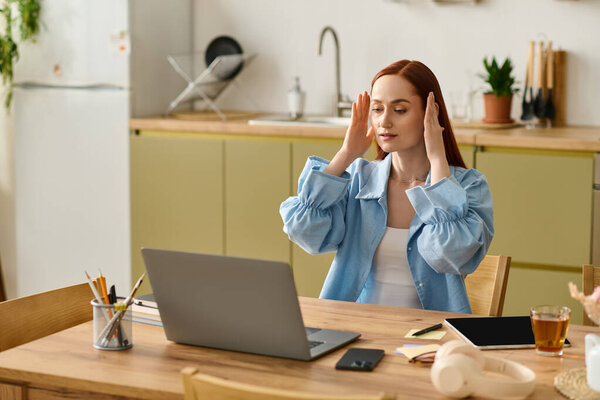 A red-haired language teacher connects with students online from her home office.