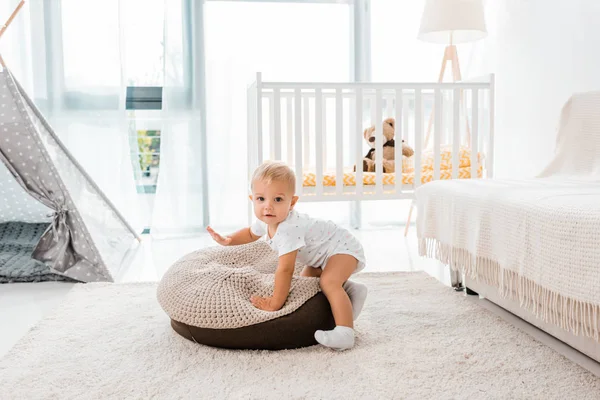 Adorable toddler in white nursery room — Stock Photo