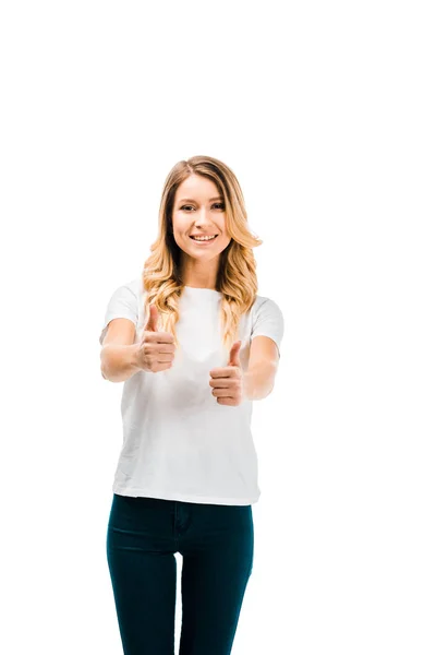 Beautiful blonde girl in white t-shirt showing thumbs up and smiling at camera isolated on white — Stock Photo