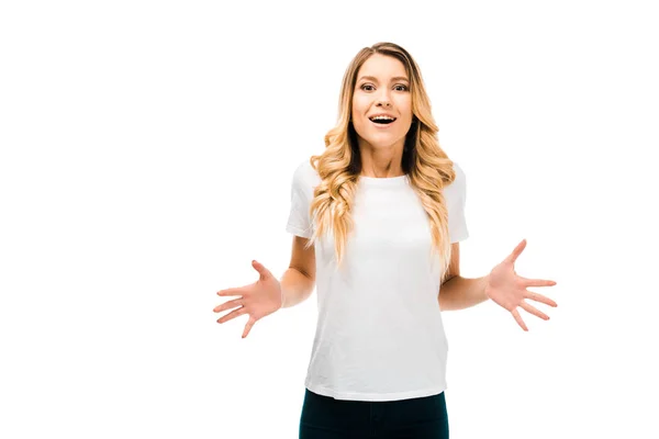 Emotional young woman gesturing with hands and looking at camera isolated on white — Stock Photo