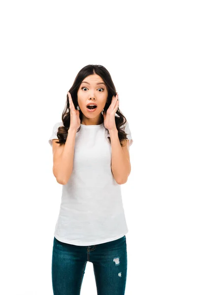 Scared young woman with open mouth looking at camera isolated on white — Stock Photo