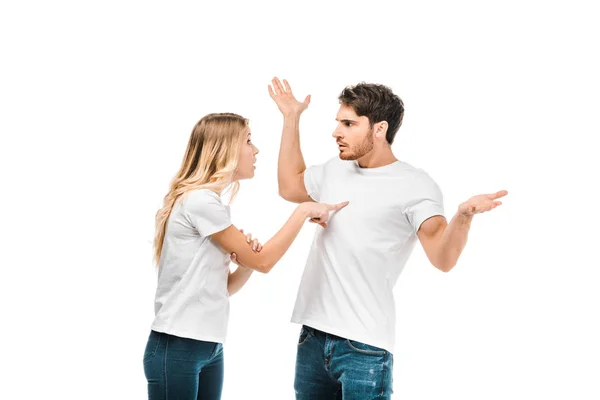 Emotional young couple quarreling isolated on white — Stock Photo