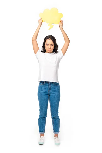 Ofendido asiático menina no branco t-shirt e azul jeans segurando vazio pensamento bolha acima cabeça isolado no branco — Fotografia de Stock