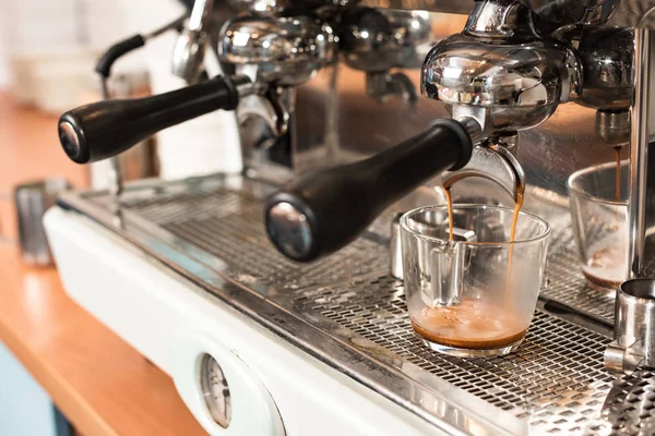 Coffee machine with portafilters and cup of coffee — Stock Photo