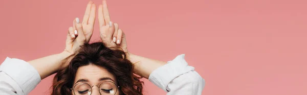 Panoramic shot of woman in glasses with closed eyes gesturing isolated on pink — Stock Photo