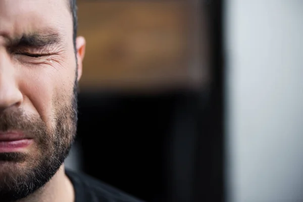 Partial view of depressed bearded man crying with closed eyes — Stock Photo