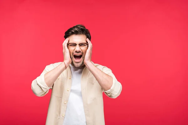 Handsome man with Hands on head screaming Isolated On pink — Stock Photo