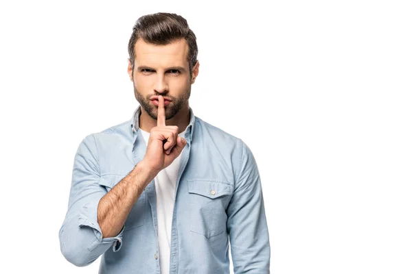 Uomo con dito sulla bocca isolato su bianco con spazio copia — Foto stock