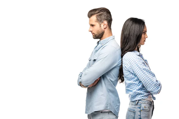Upset man and young woman standing back to back with crossed arms Isolated On White — Stock Photo