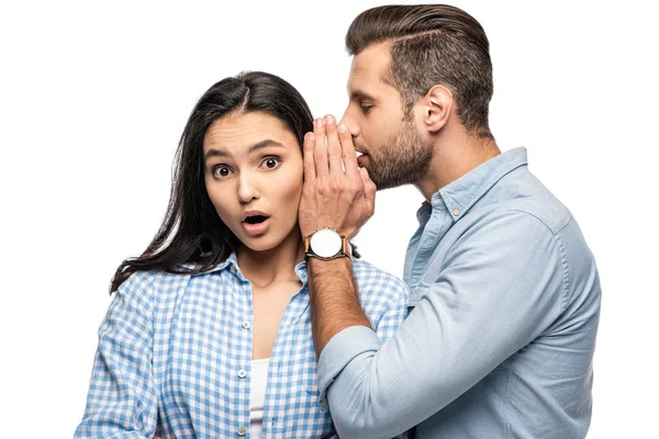 Man telling secret to shocked young woman Isolated On White — Stock Photo